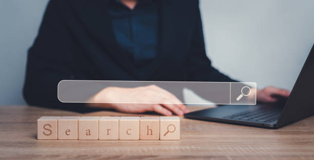 Businessman using laptop searching Browsing Internet Data Information.