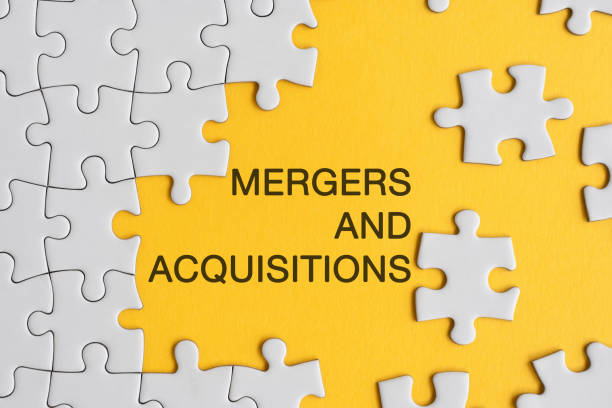 Puzzle with mergers and acquisitions- Business acquisition plan concept