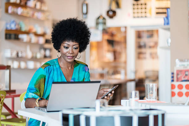 Business woman on computer. How to register your business in Ghana