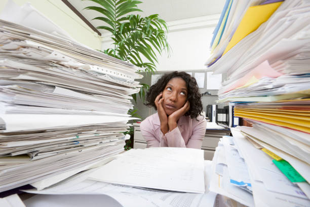 Businesswoman and a pile of paper. Challenges of doing business in ghana