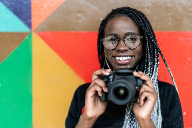 Photographer with a camera. Businesses to start in Ghana