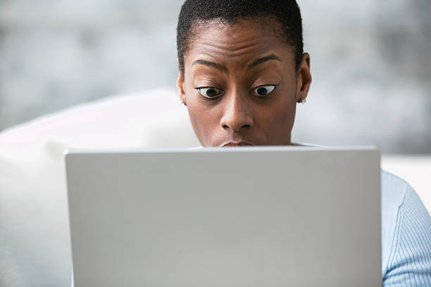 shocked woman with a laptop