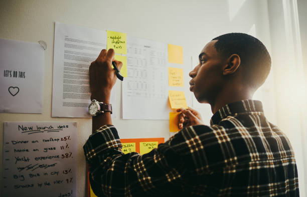 Business owner writing on a board